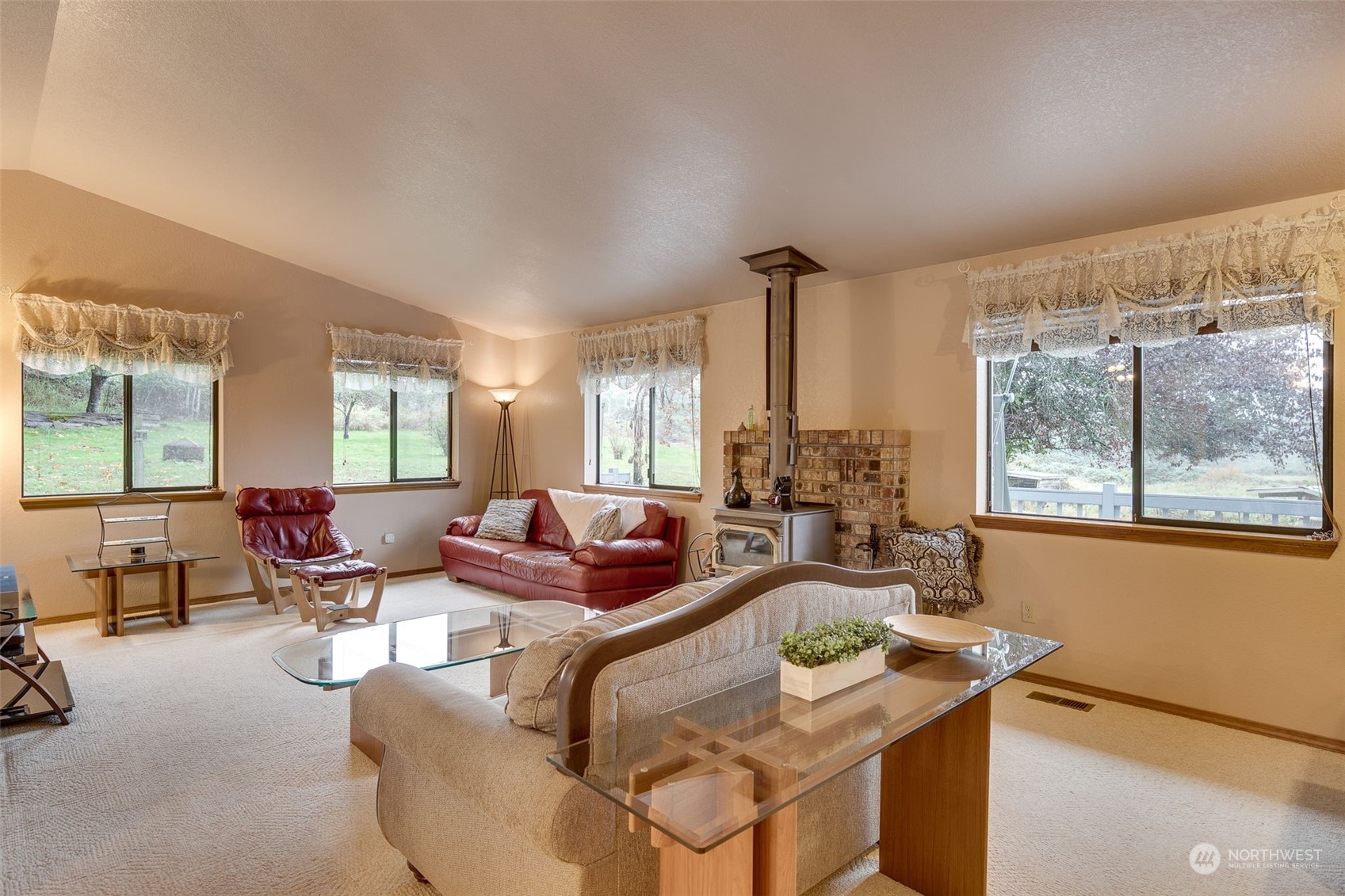 10021 Wagner Road Snohomish, WA 98290 - Photo 6 of 28 a living room with fireplace furniture and a large window