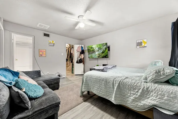 a view of a house with backyard and sitting area