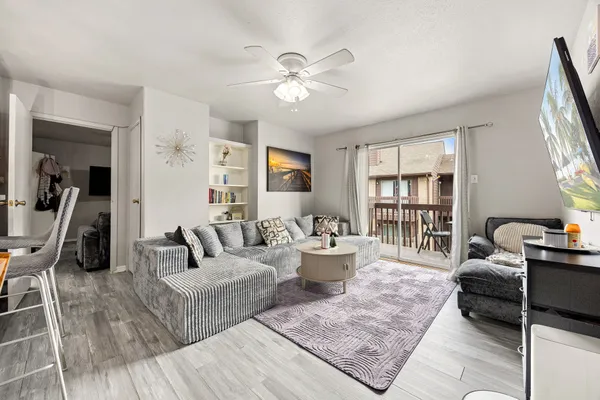 a living room with furniture and a table
