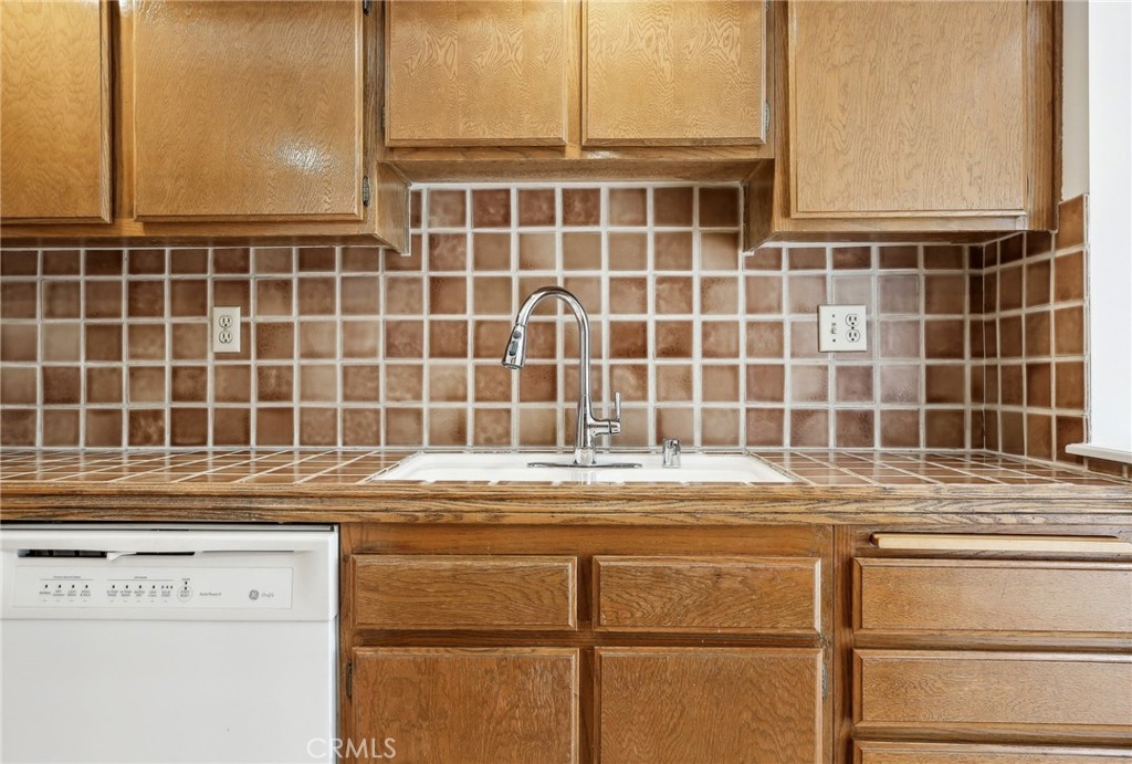 735 Wingate Bay, Unit 50 Costa Mesa, CA 92626 - Photo 13 of 32 a view of a kitchen with a sink