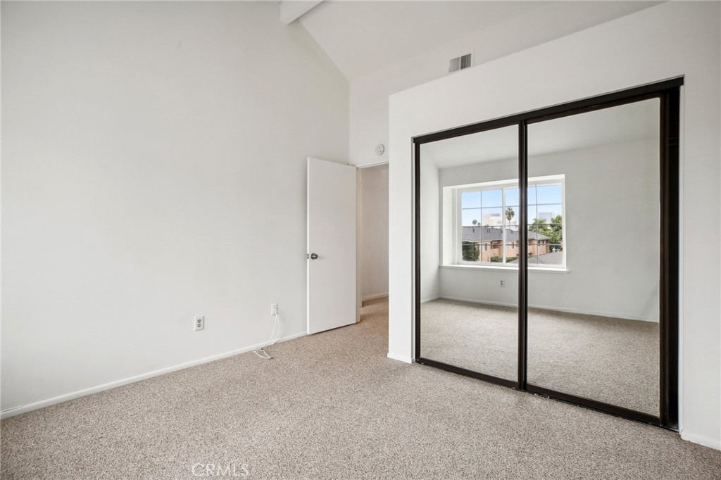 735 Wingate Bay, Unit 50 Costa Mesa, CA 92626 - Photo 16 of 32 a view of empty room with floor to ceiling window
