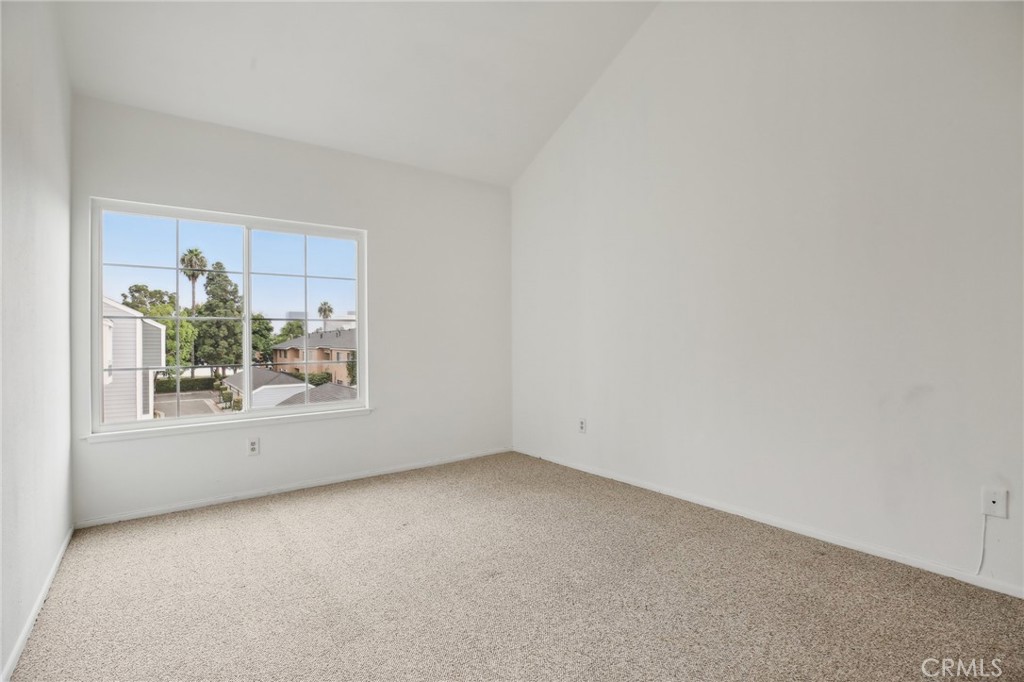 735 Wingate Bay, Unit 50 Costa Mesa, CA 92626 - Photo 18 of 32 an empty room with a window