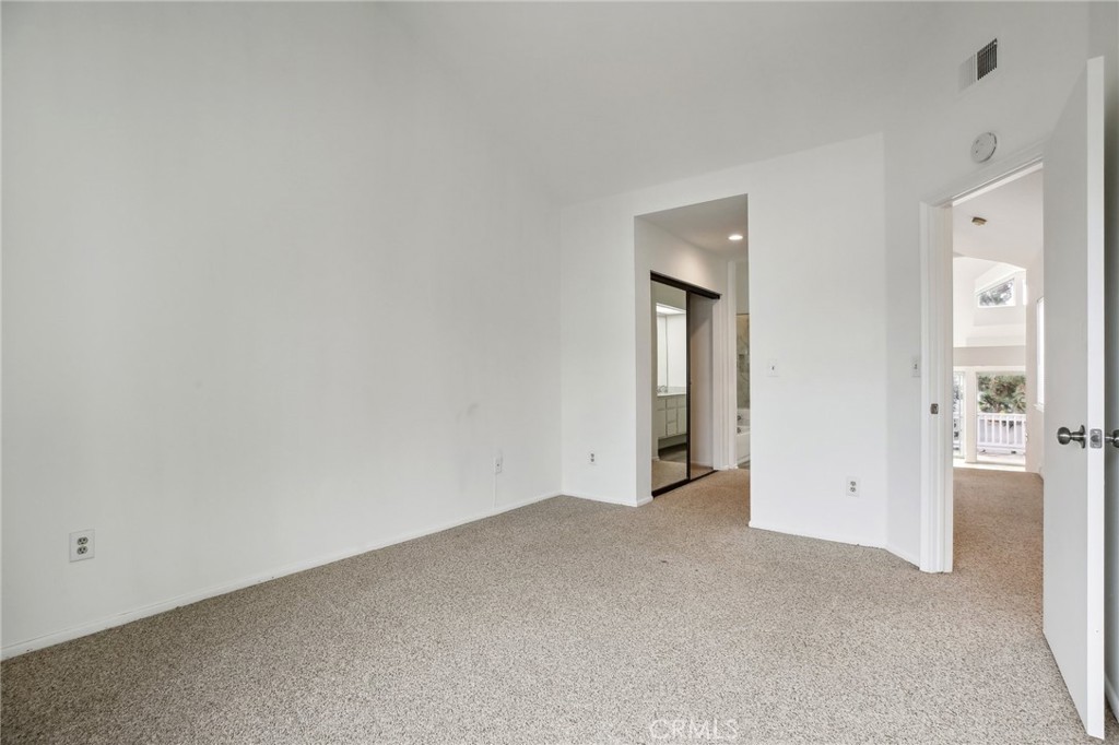 735 Wingate Bay, Unit 50 Costa Mesa, CA 92626 - Photo 20 of 32 a view of an empty room with a window