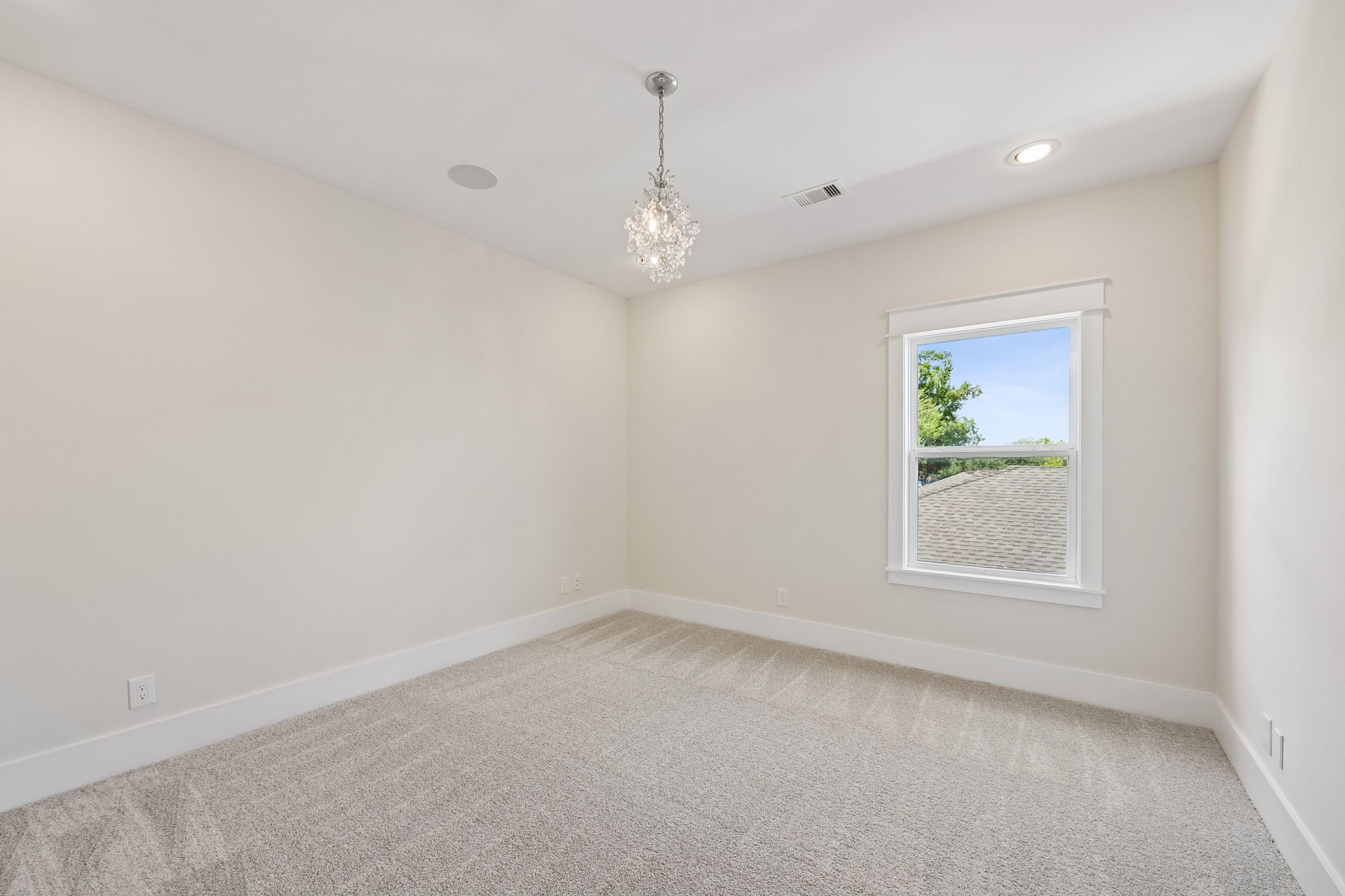 8558 Ridgepoint Drive Houston, TX 77055 - Photo 26 of 39 Window light, neutral walls, and a ceiling fan create a comfortable backdrop for rest or everyday use.