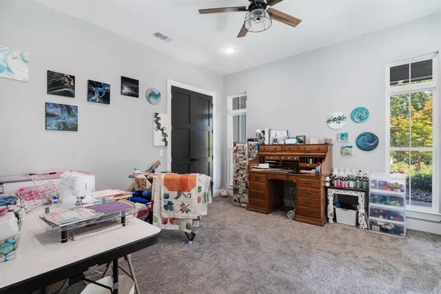 a bedroom with furniture and a window