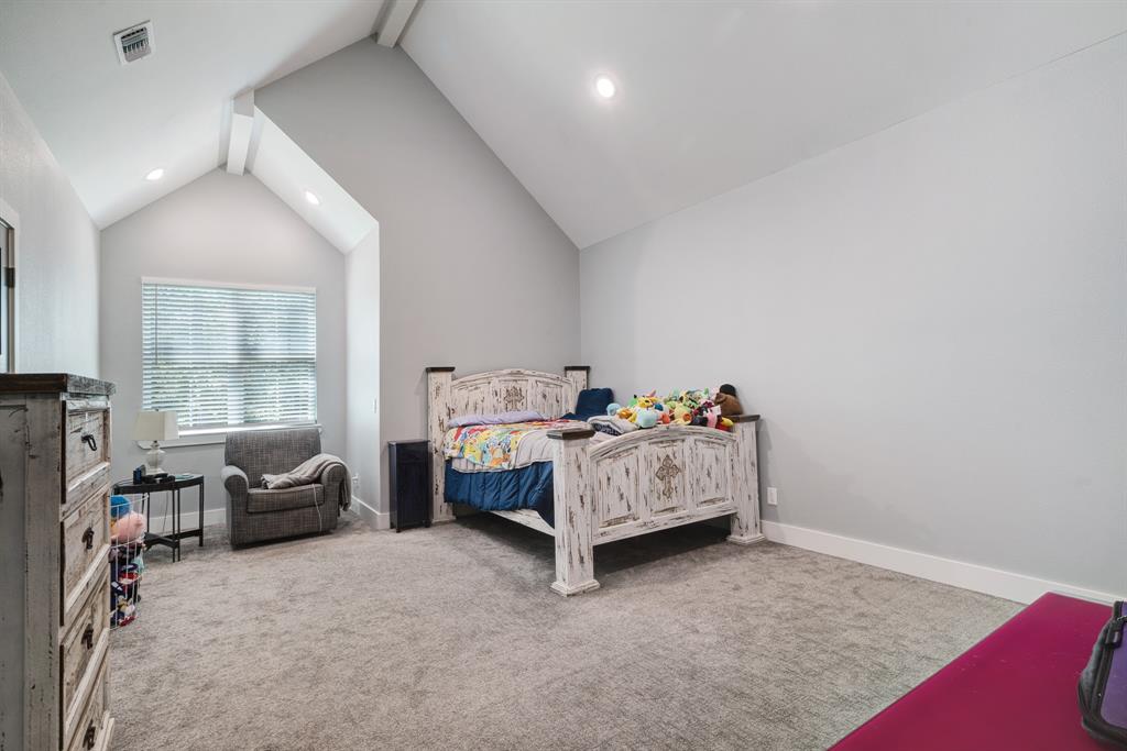 545 County Road Paris, TX 75462 - Photo 17 of 40 a bed room with a bed and a chair