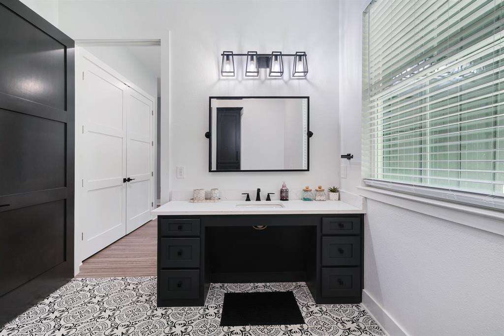 545 County Road Paris, TX 75462 - Photo 18 of 40 a bathroom with a sink and a mirror
