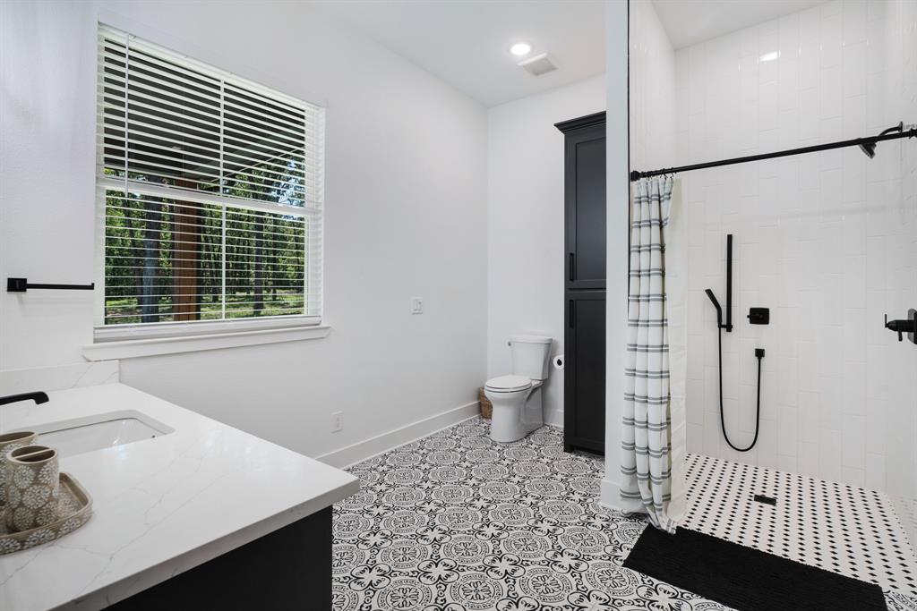 545 County Road Paris, TX 75462 - Photo 19 of 40 a bathroom with a sink toilet and shower