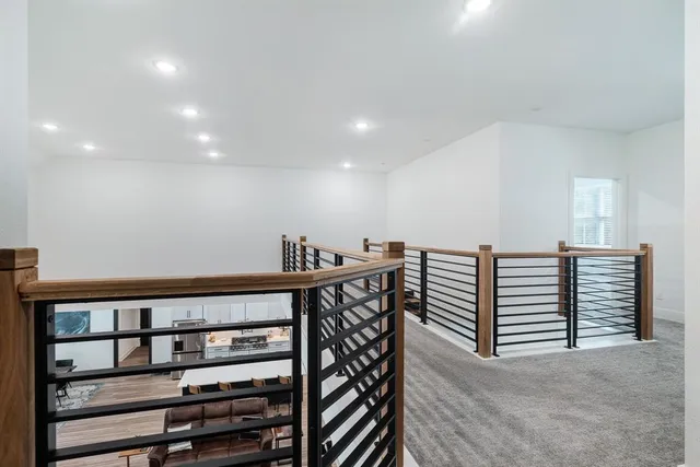 a view of a hallway with seating space