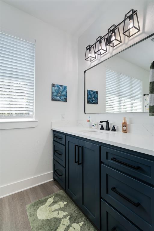 545 County Road Paris, TX 75462 - Photo 24 of 40 a bathroom with a sink vanity and mirror