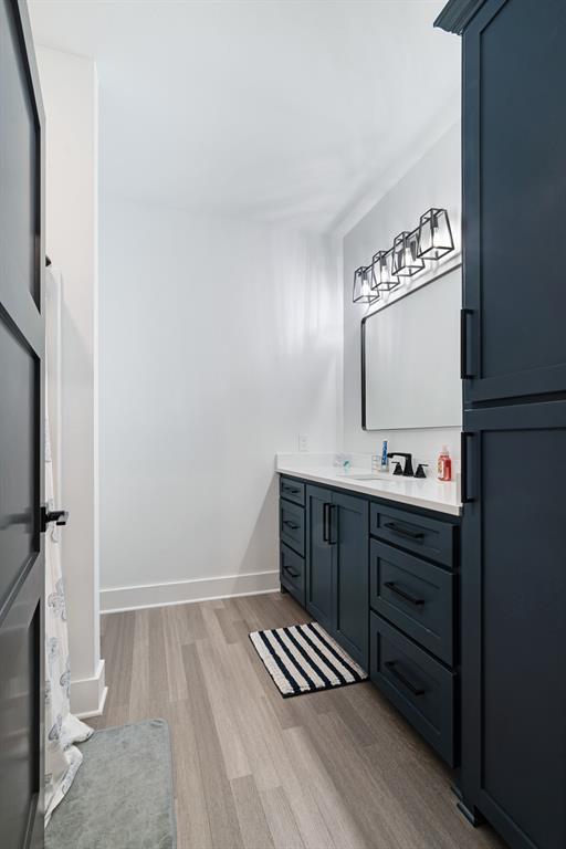 545 County Road Paris, TX 75462 - Photo 25 of 40 a bathroom with a sink and a mirror
