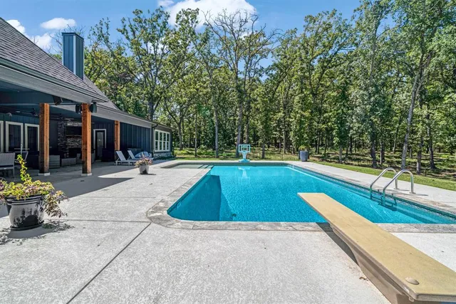 a view of a swimming pool with a lounge chair