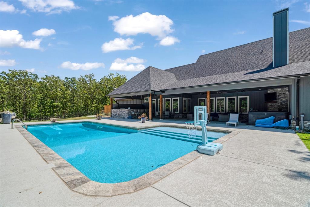 545 County Road Paris, TX 75462 - Photo 28 of 40 a view of a house with swimming pool and sitting area