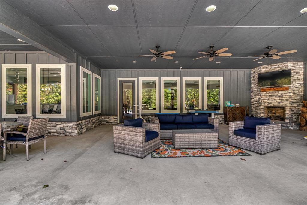 545 County Road Paris, TX 75462 - Photo 31 of 40 a living room with furniture fireplace and large windows