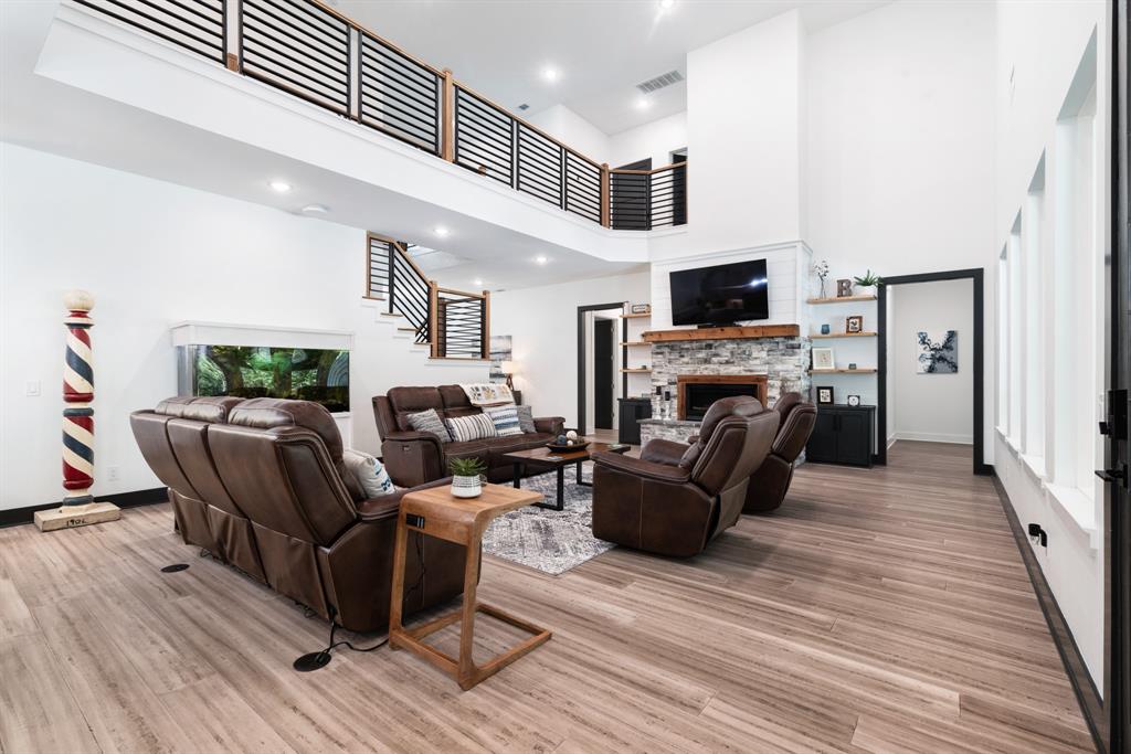 545 County Road Paris, TX 75462 - Photo 4 of 40 a living room with furniture a flat screen tv and a fireplace