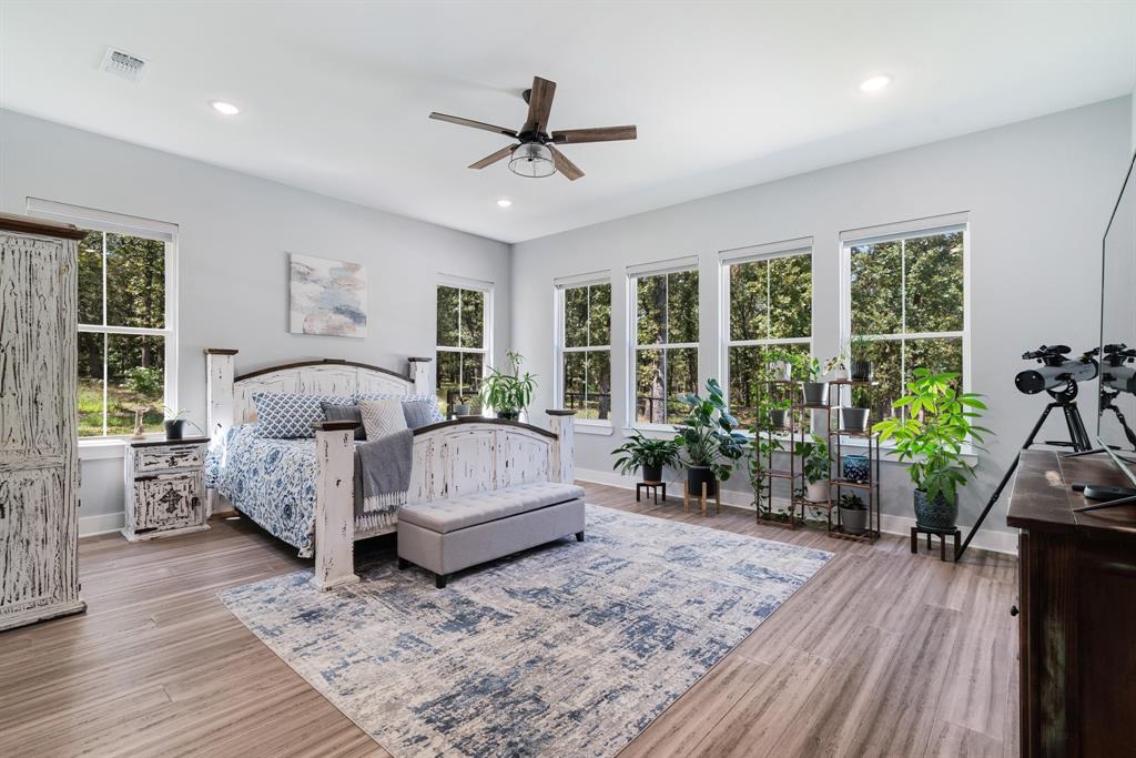 545 County Road Paris, TX 75462 - Photo 10 of 40 a bedroom with furniture and a large window