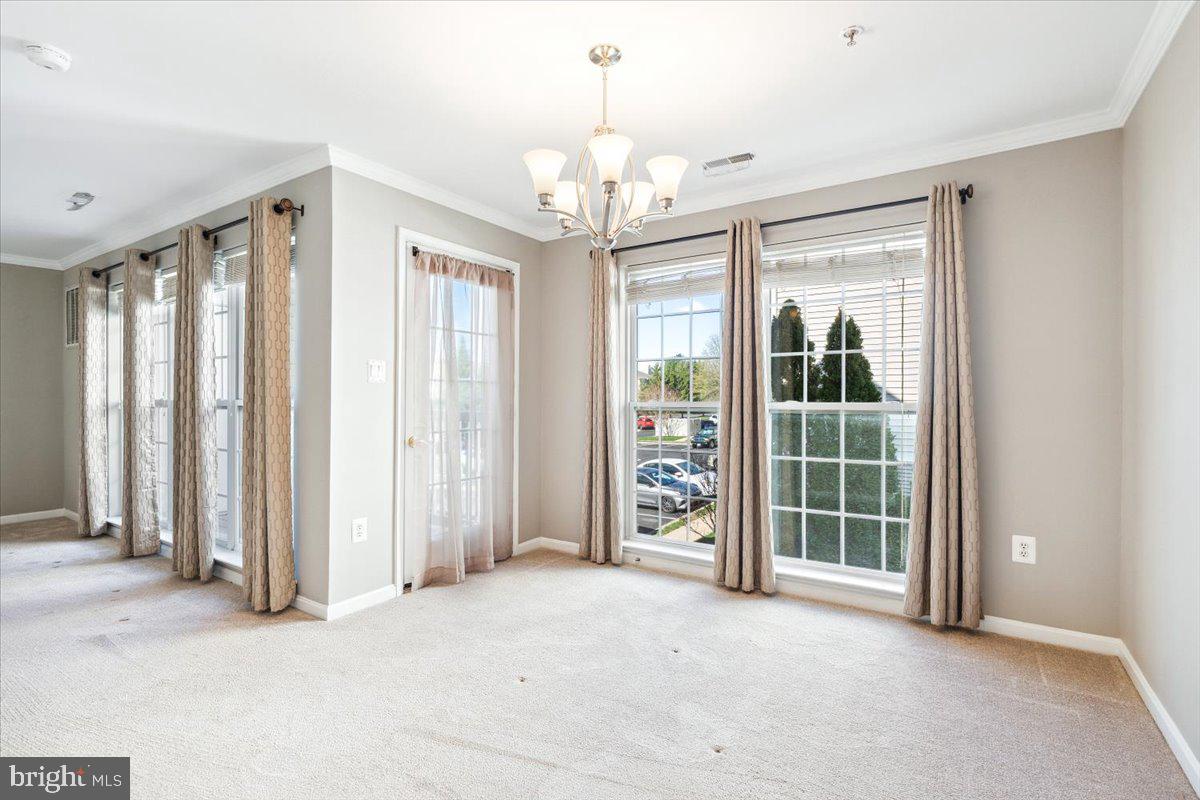599 Cawley Drive, Unit 2A Frederick, MD 21703 - Photo 12 of 32 an empty room with windows and closet