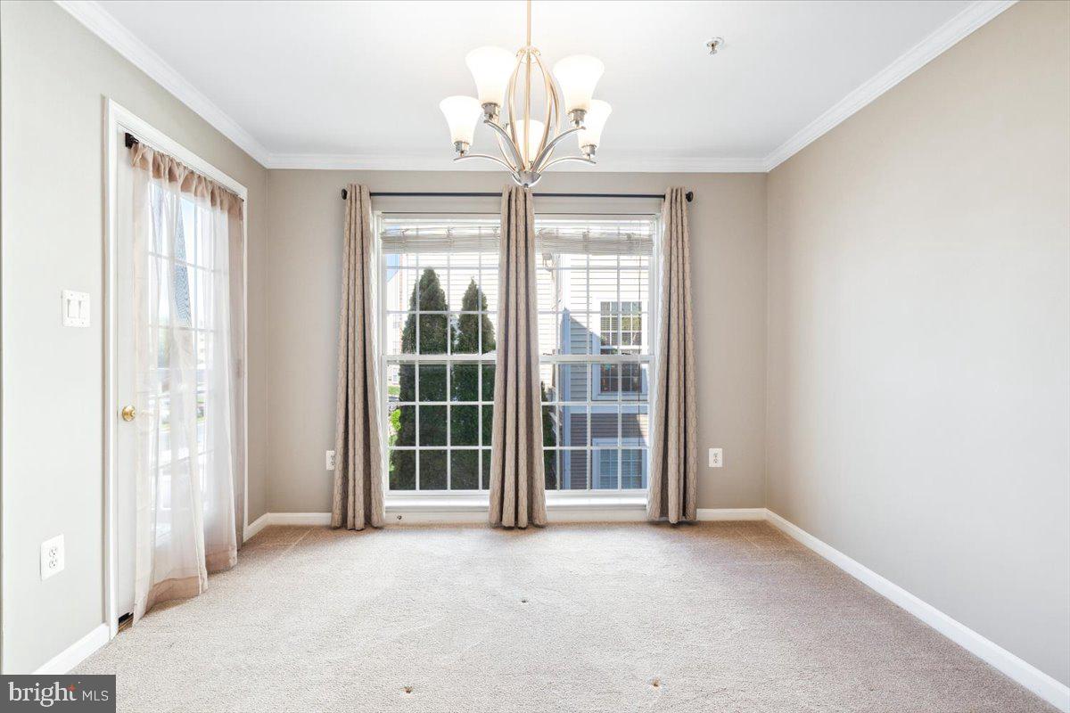 599 Cawley Drive, Unit 2A Frederick, MD 21703 - Photo 13 of 32 a view of a room with a chandelier