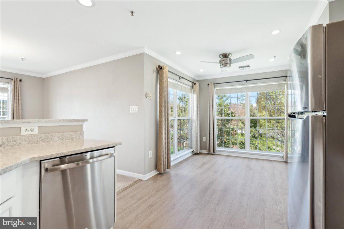 599 Cawley Drive, Unit 2A Frederick, MD 21703 - Photo 19 of 32 a view of entryway with kitchen and wooden floor