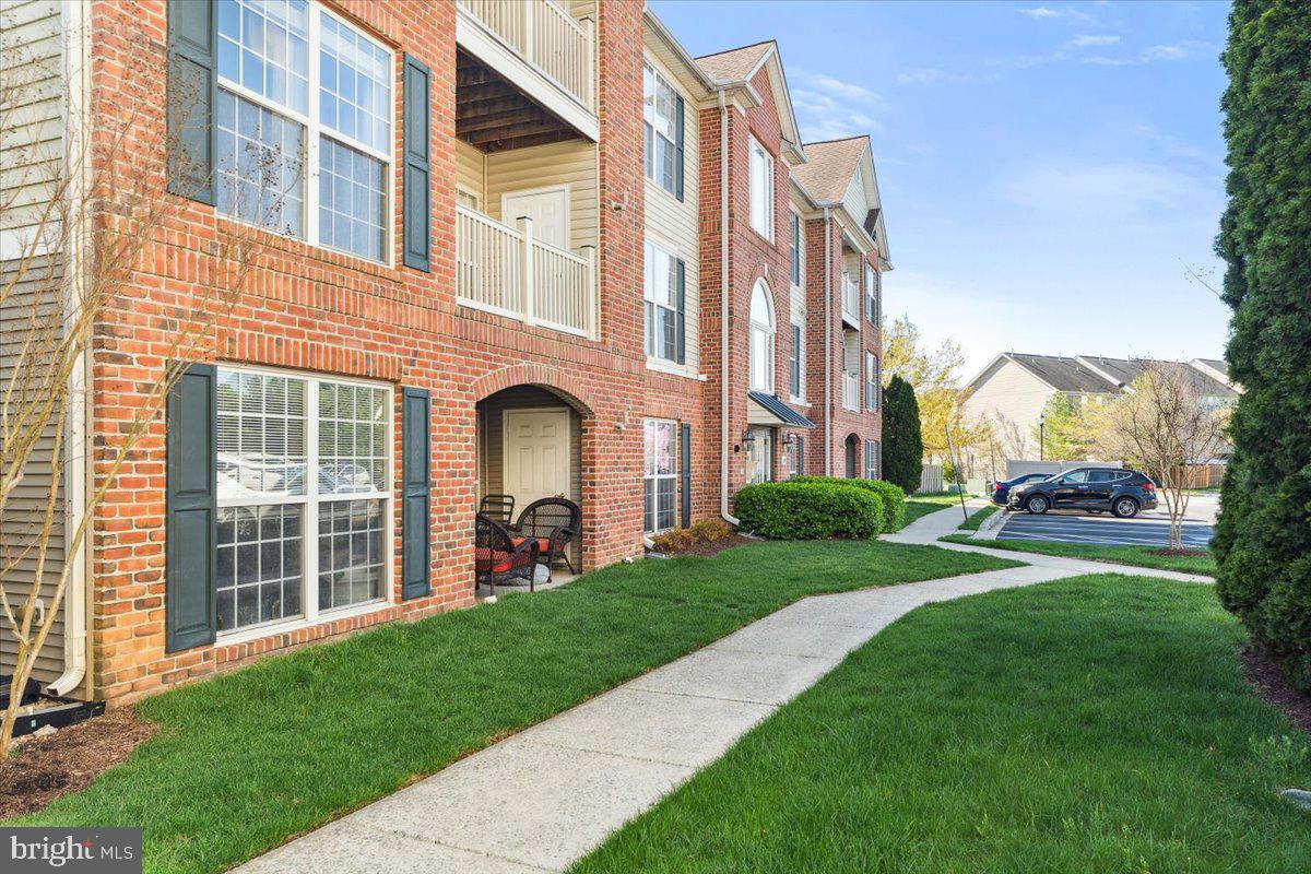 599 Cawley Drive, Unit 2A Frederick, MD 21703 - Photo 2 of 32 a view of a building with a yard