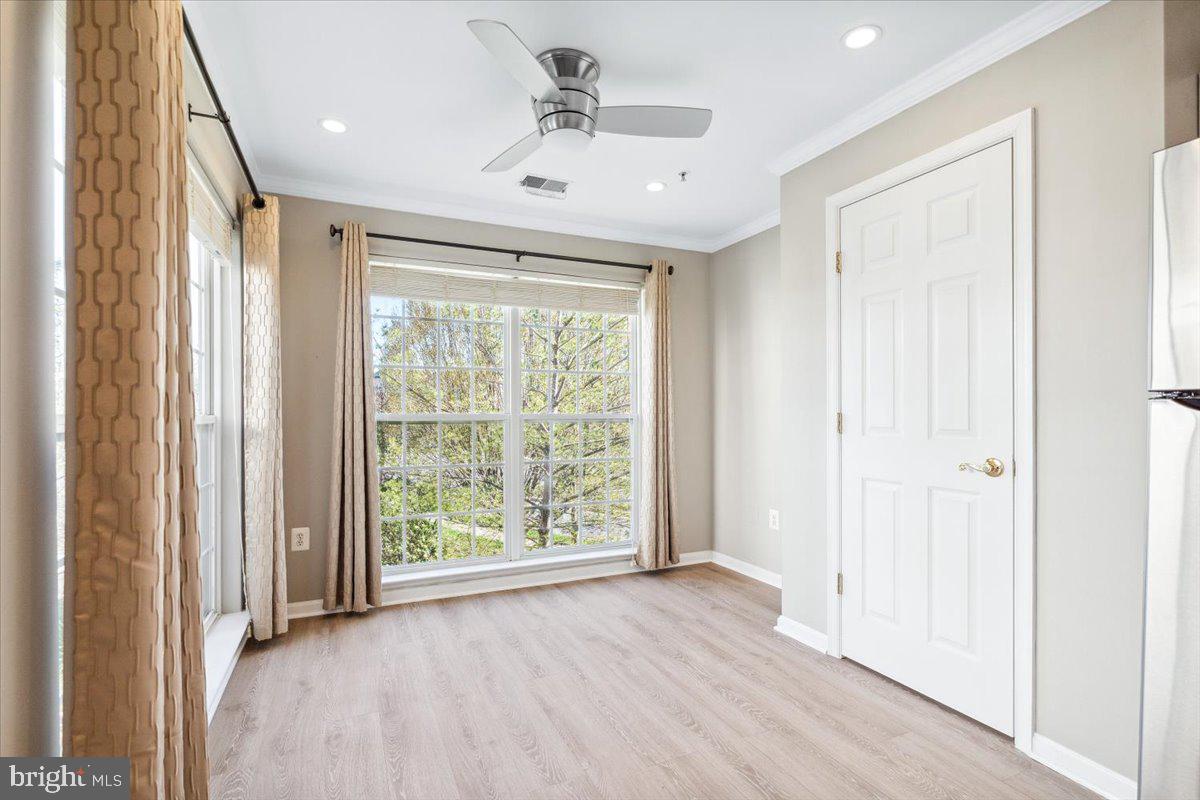 599 Cawley Drive, Unit 2A Frederick, MD 21703 - Photo 21 of 32 a view of a livingroom with a ceiling fan and window