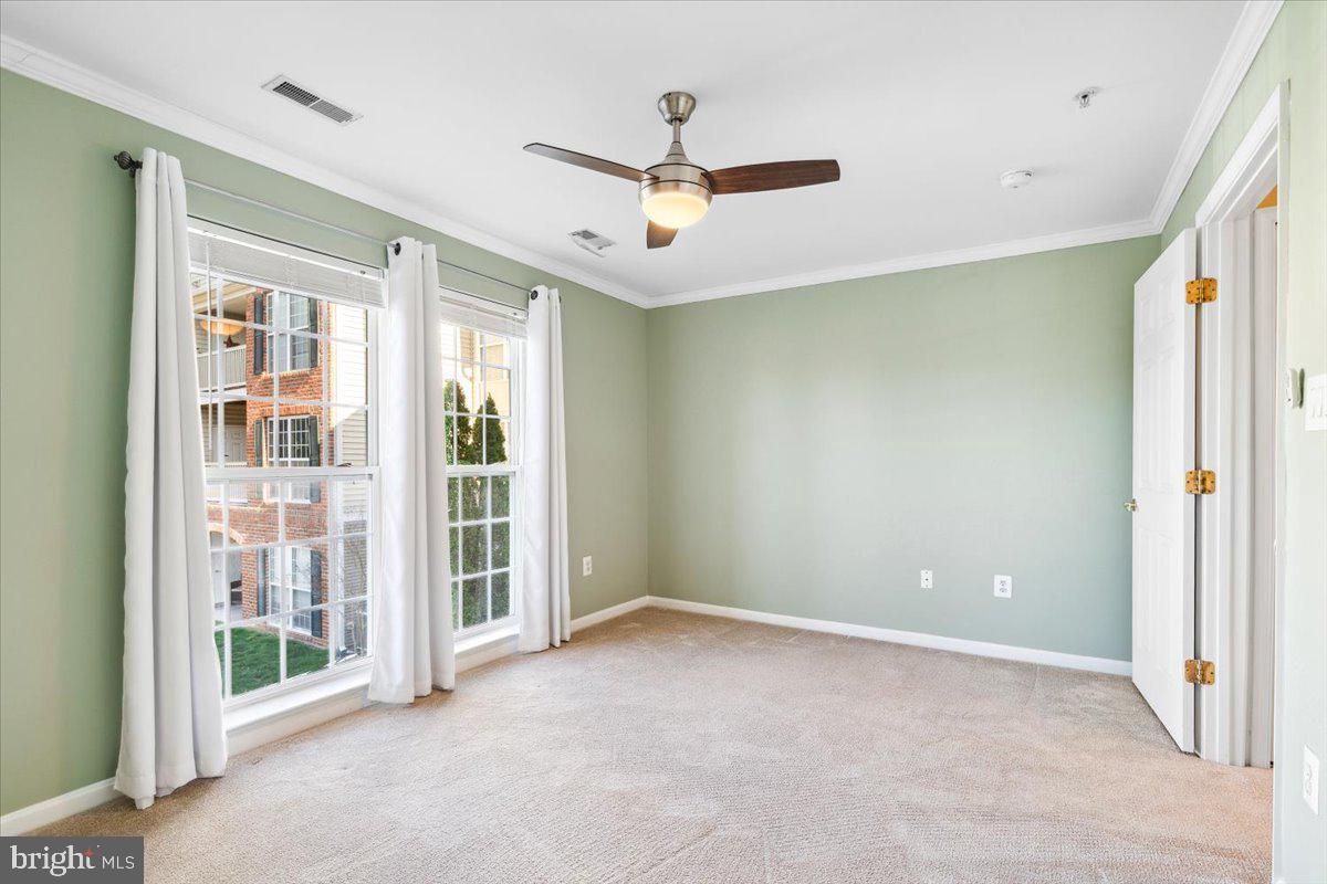 599 Cawley Drive, Unit 2A Frederick, MD 21703 - Photo 25 of 32 a view of an empty room with a window