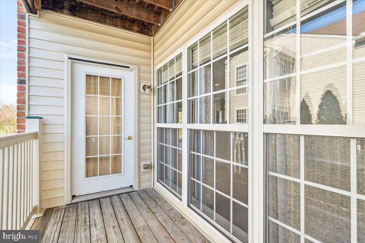 599 Cawley Drive, Unit 2A Frederick, MD 21703 - Photo 32 of 32 a view of a balcony with wooden floor and windows