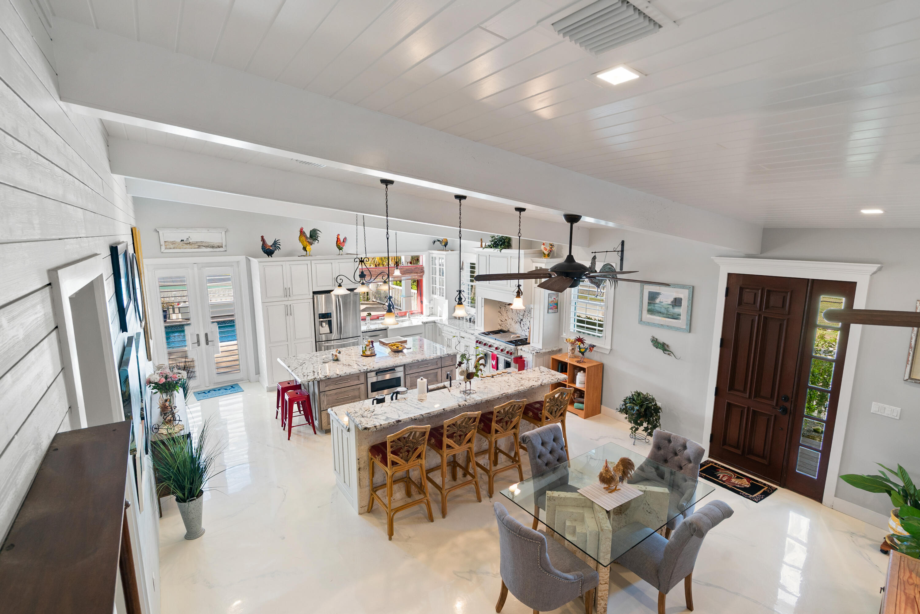 65 Tarpon Avenue Key Largo, FL 33037 - Photo 25 of 54 a view of a livingroom with furniture and flat screen tv