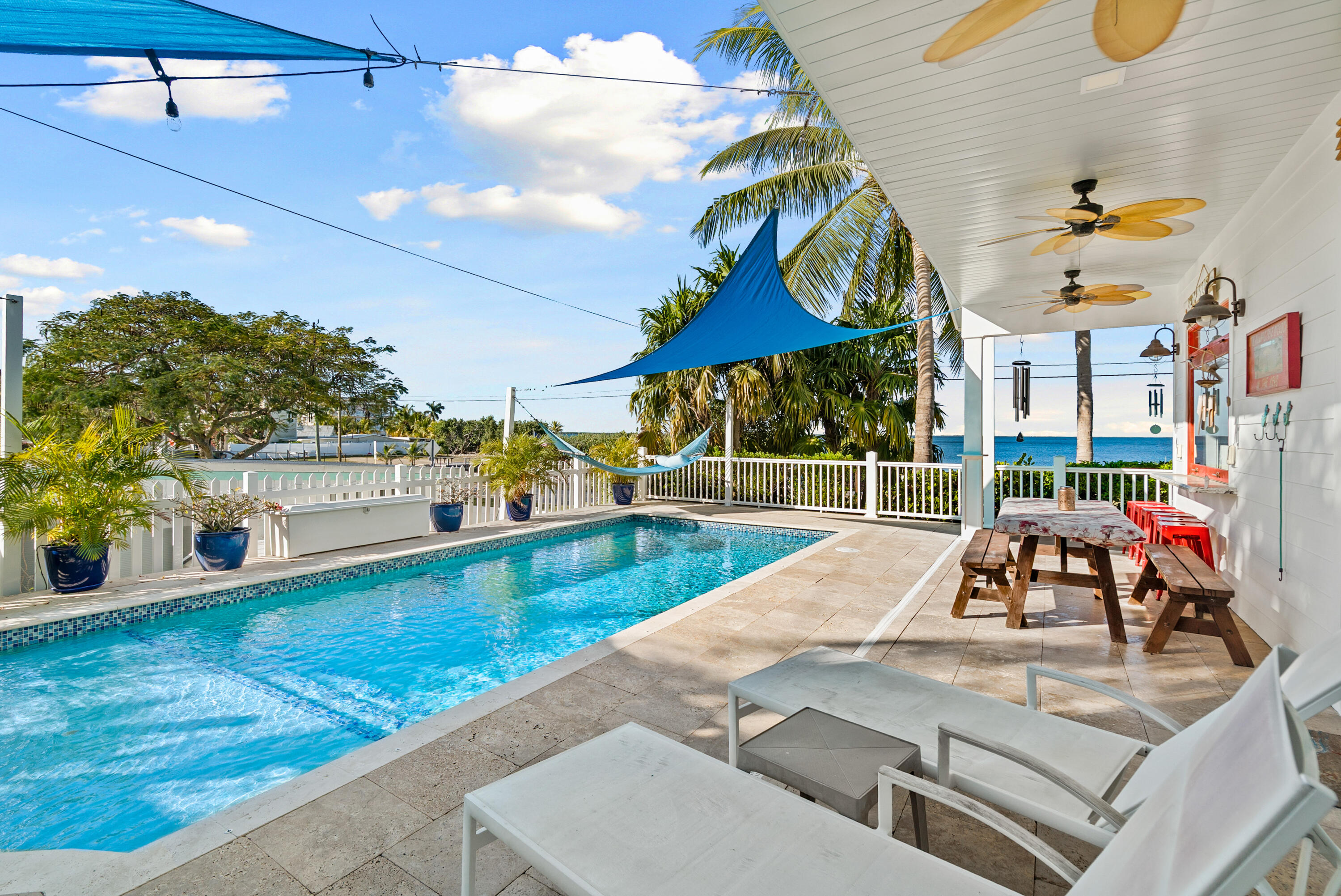 65 Tarpon Avenue Key Largo, FL 33037 - Photo 27 of 54 a view of a swimming pool with a deck