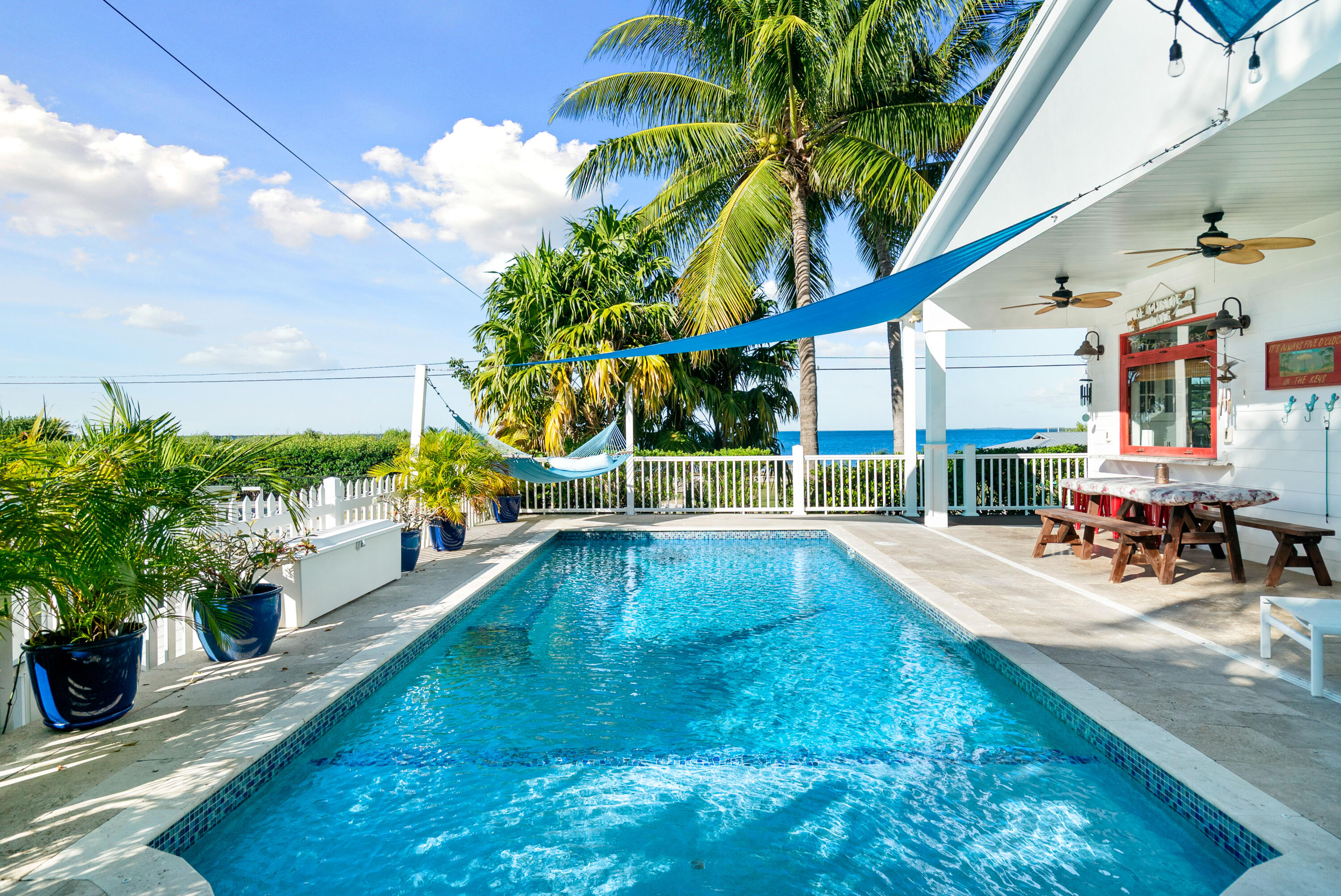 65 Tarpon Avenue Key Largo, FL 33037 - Photo 28 of 54 a view of a swimming pool with a patio
