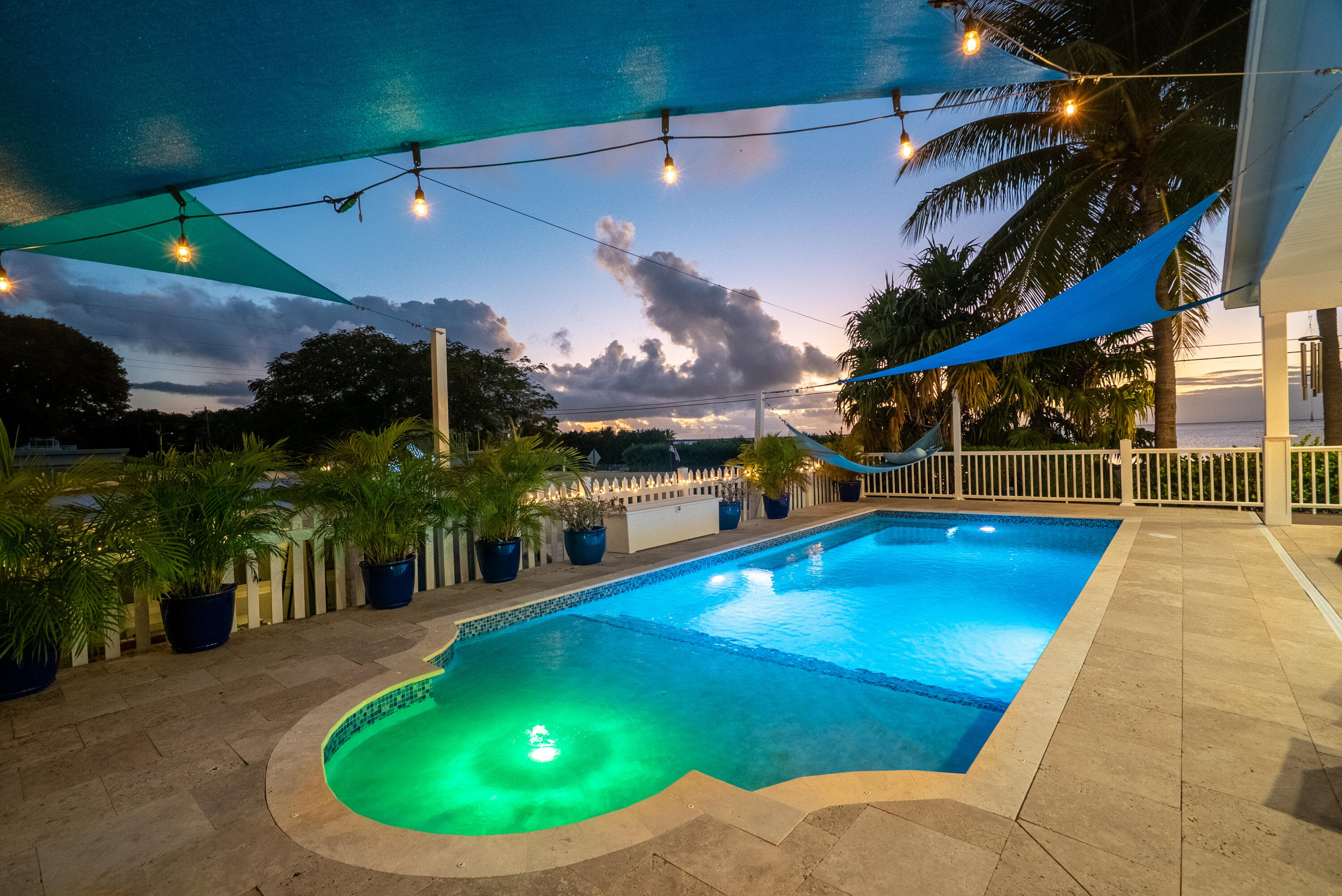 65 Tarpon Avenue Key Largo, FL 33037 - Photo 45 of 54 a view of a swimming pool with a patio and a yard