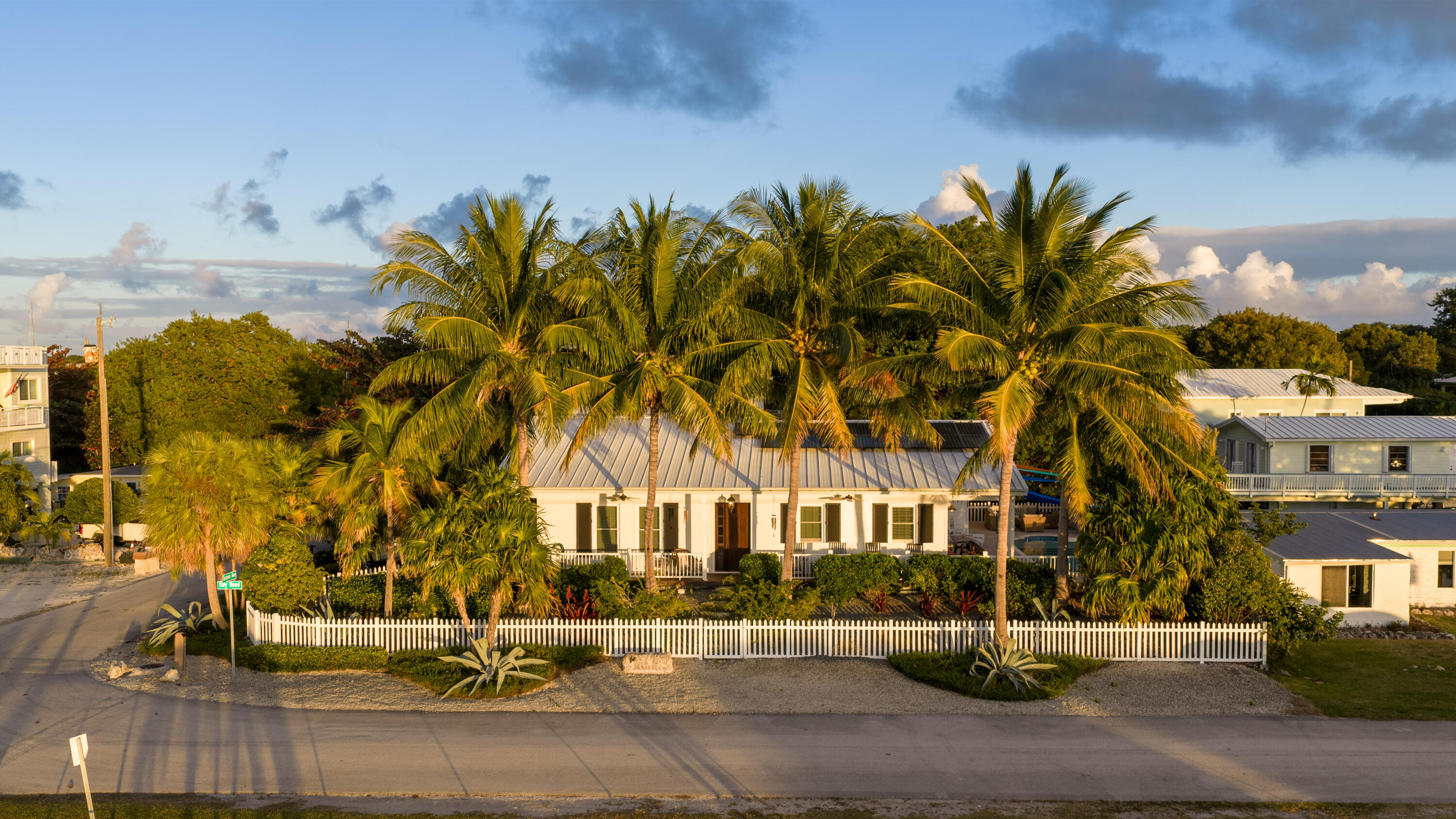 65 Tarpon Avenue Key Largo, FL 33037 - Photo 53 of 54 a front view of a house with a yard