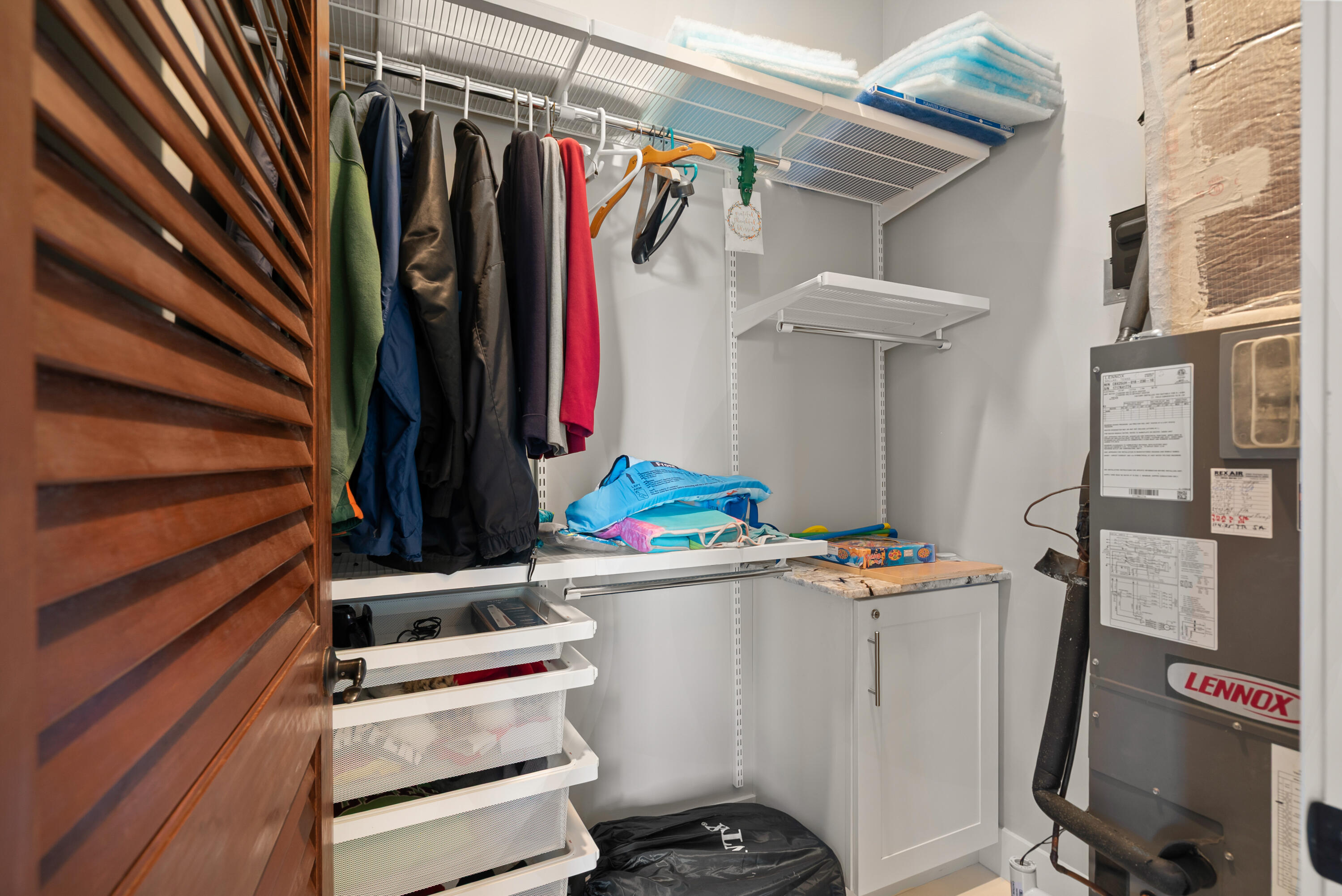 65 Tarpon Avenue Key Largo, FL 33037 - Photo 54 of 54 a view of walk in closet with clothes and shoes