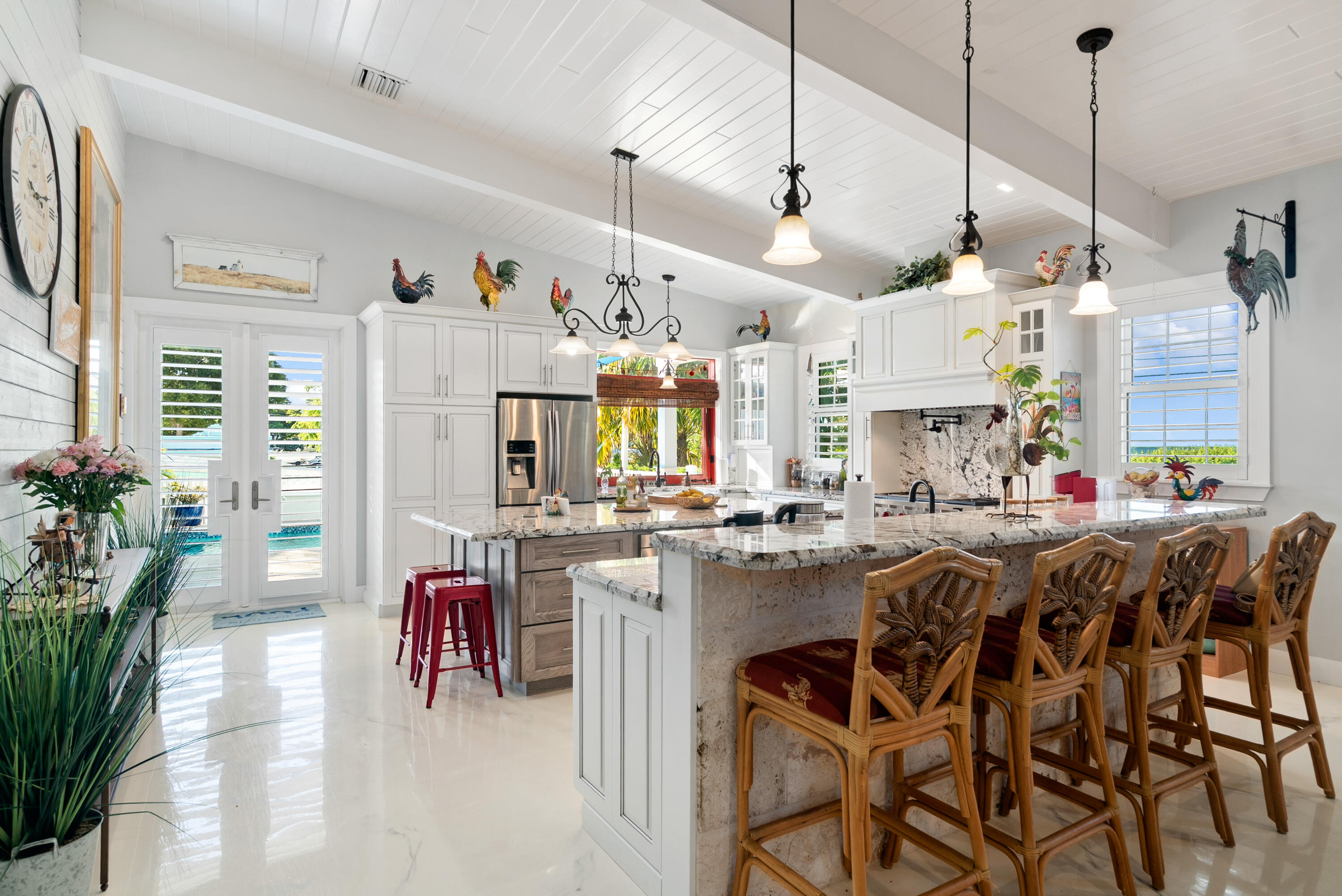 65 Tarpon Avenue Key Largo, FL 33037 - Photo 8 of 54 a view of a dining room and livingroom with furniture wooden floor a chandelier