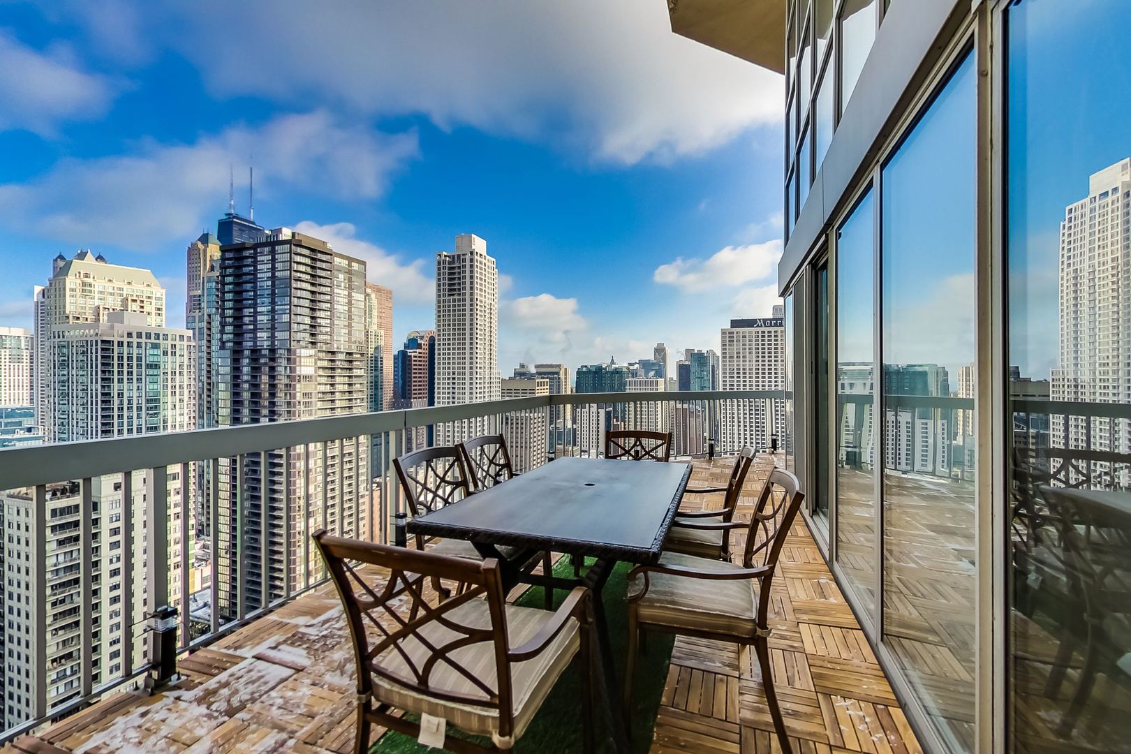 545 North Dearborn Street, Unit 3603 Chicago, IL 60654 - Photo 15 of 42 a view of a chairs and table on the deck