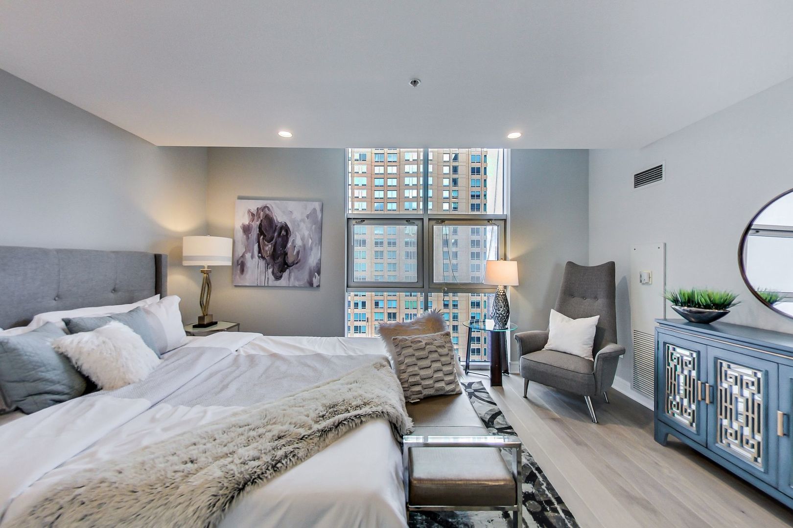 545 North Dearborn Street, Unit 3603 Chicago, IL 60654 - Photo 19 of 42 a bed room with a bed and a chair