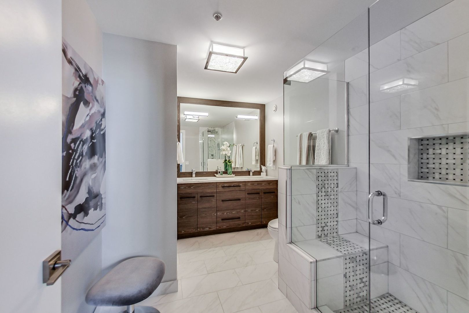 545 North Dearborn Street, Unit 3603 Chicago, IL 60654 - Photo 21 of 42 a bathroom with a tub sink and mirror