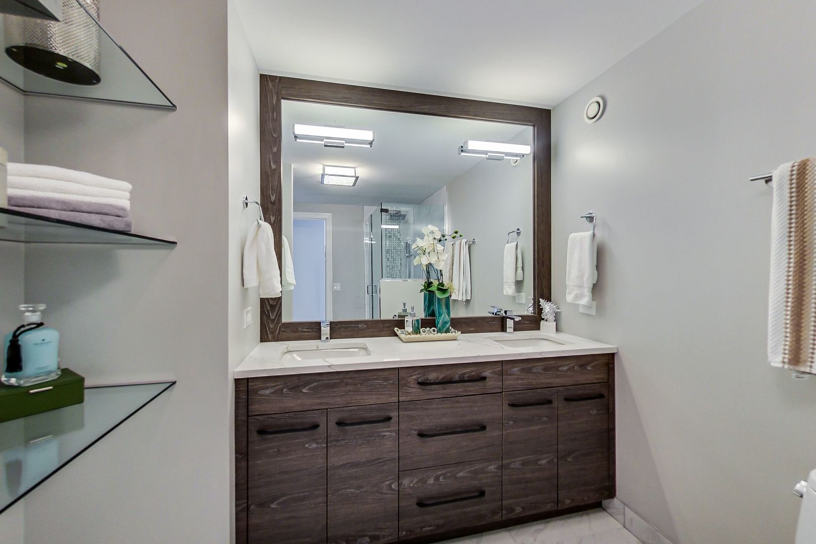 545 North Dearborn Street, Unit 3603 Chicago, IL 60654 - Photo 22 of 42 a bathroom with a double vanity sink and a mirror