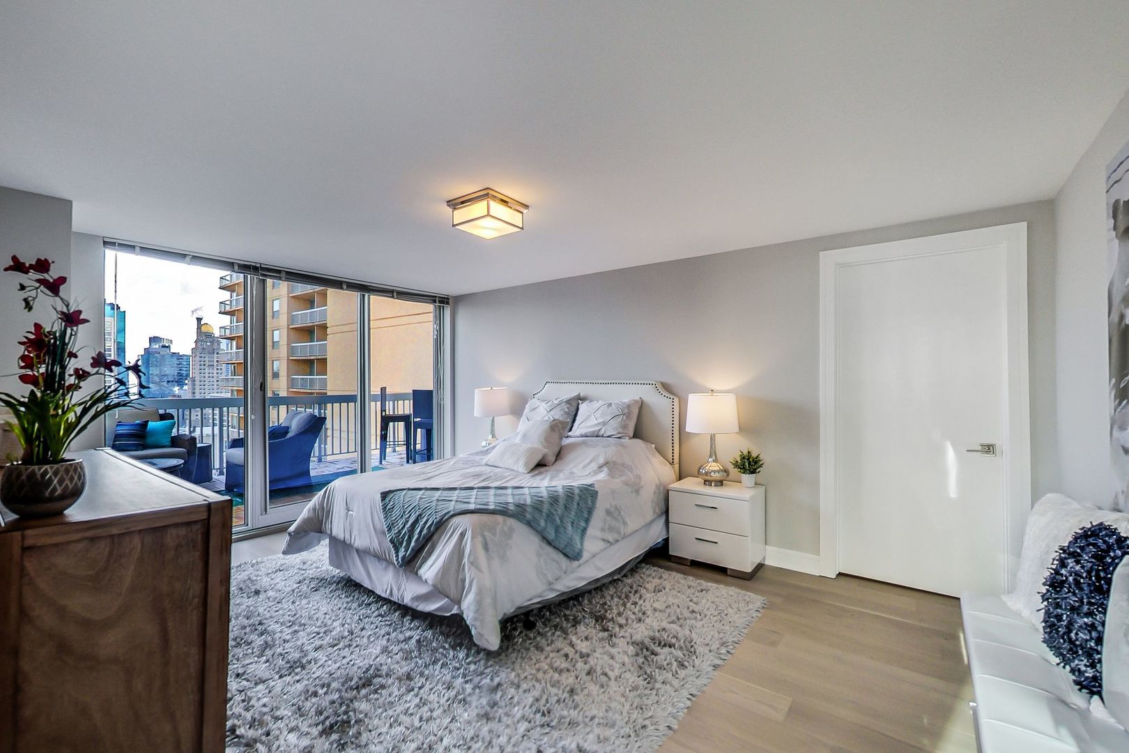545 North Dearborn Street, Unit 3603 Chicago, IL 60654 - Photo 24 of 42 a bedroom with a bed and large windows