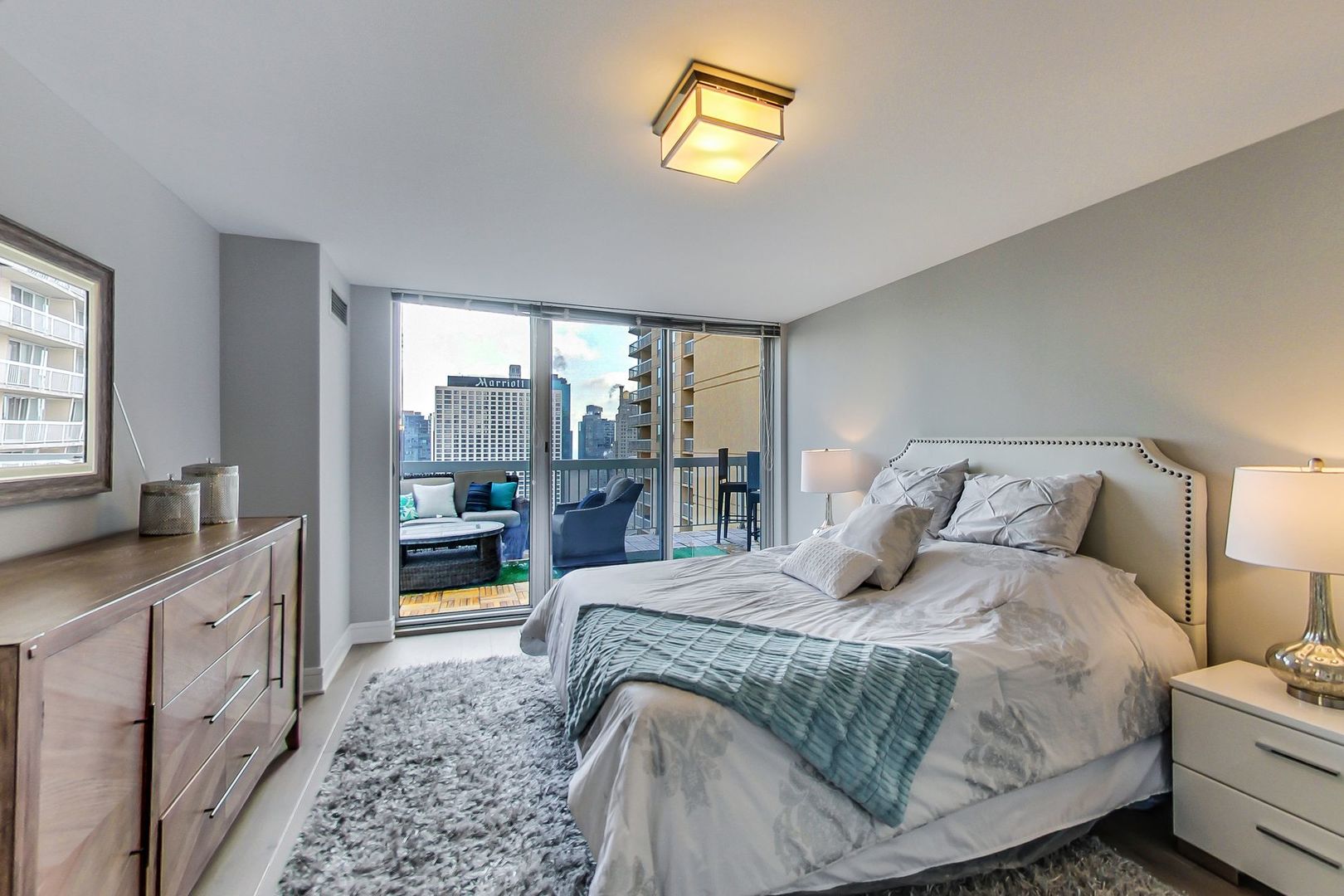 545 North Dearborn Street, Unit 3603 Chicago, IL 60654 - Photo 25 of 42 a bedroom with a bed and a cabinets