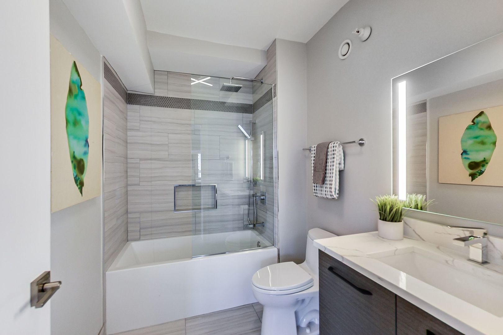 545 North Dearborn Street, Unit 3603 Chicago, IL 60654 - Photo 27 of 42 a bathroom with a sink toilet and shower