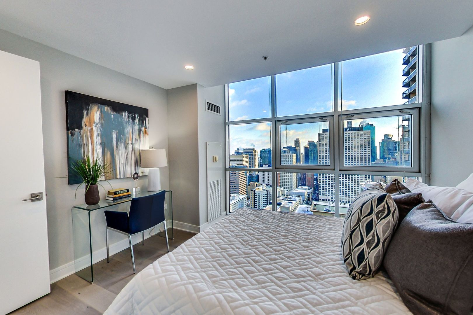 545 North Dearborn Street, Unit 3603 Chicago, IL 60654 - Photo 29 of 42 a room with furniture a rug and a chandelier