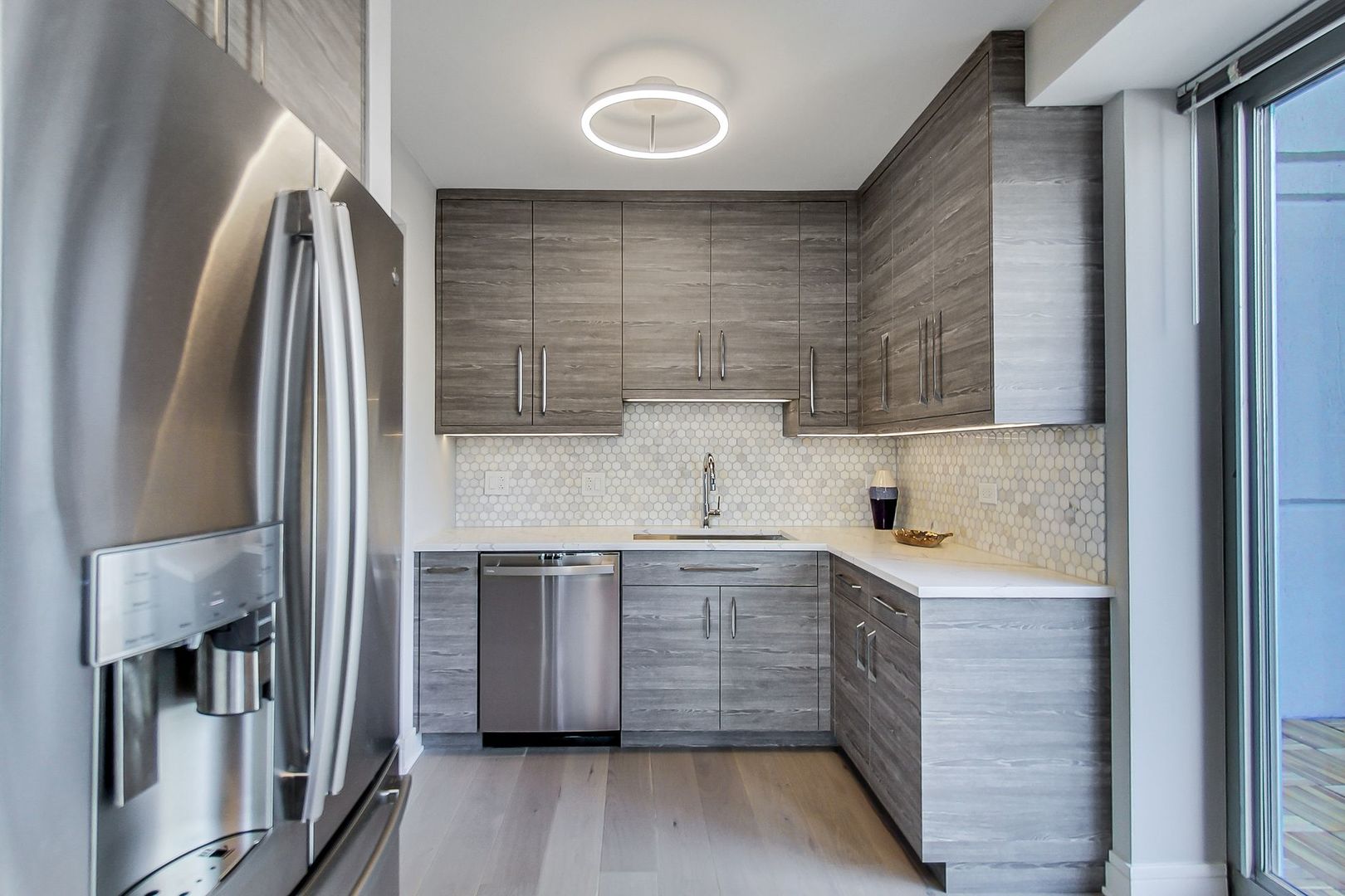 545 North Dearborn Street, Unit 3603 Chicago, IL 60654 - Photo 8 of 42 a kitchen with stainless steel appliances granite countertop a sink stove and refrigerator