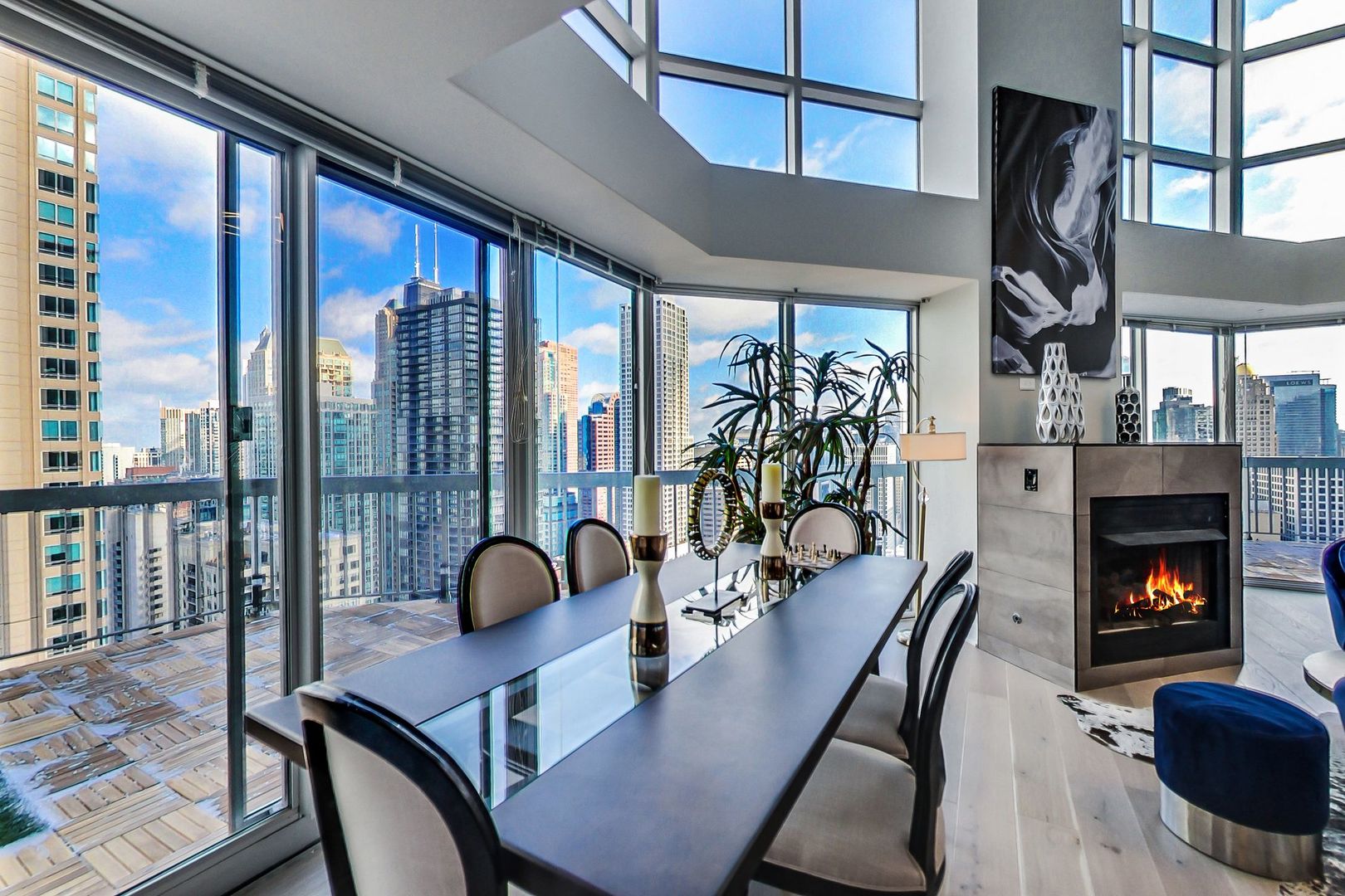 545 North Dearborn Street, Unit 3603 Chicago, IL 60654 - Photo 10 of 42 a living room with furniture fireplace and floor to ceiling windows