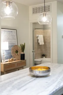 a bathroom with a tub and shower