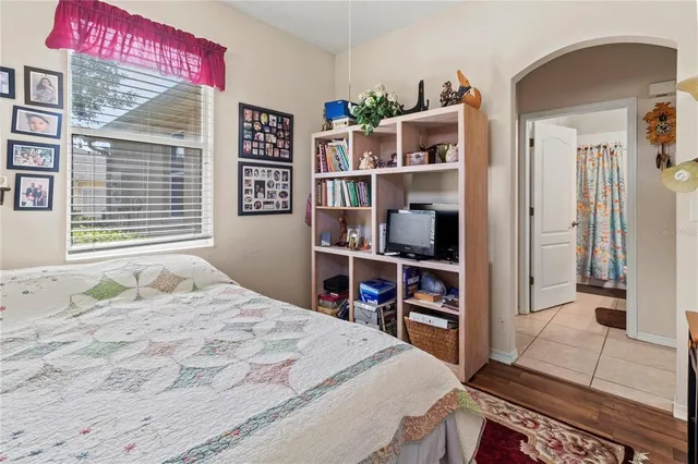 a bedroom with a bed and a large cabinets