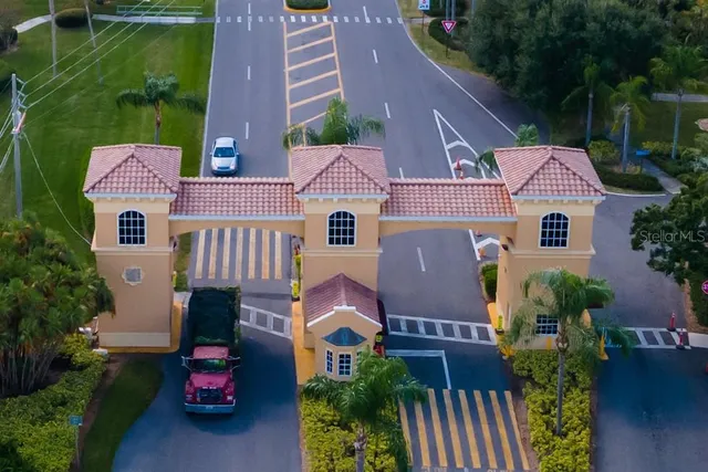 a aerial view of a house with table and chairs and potted plants
