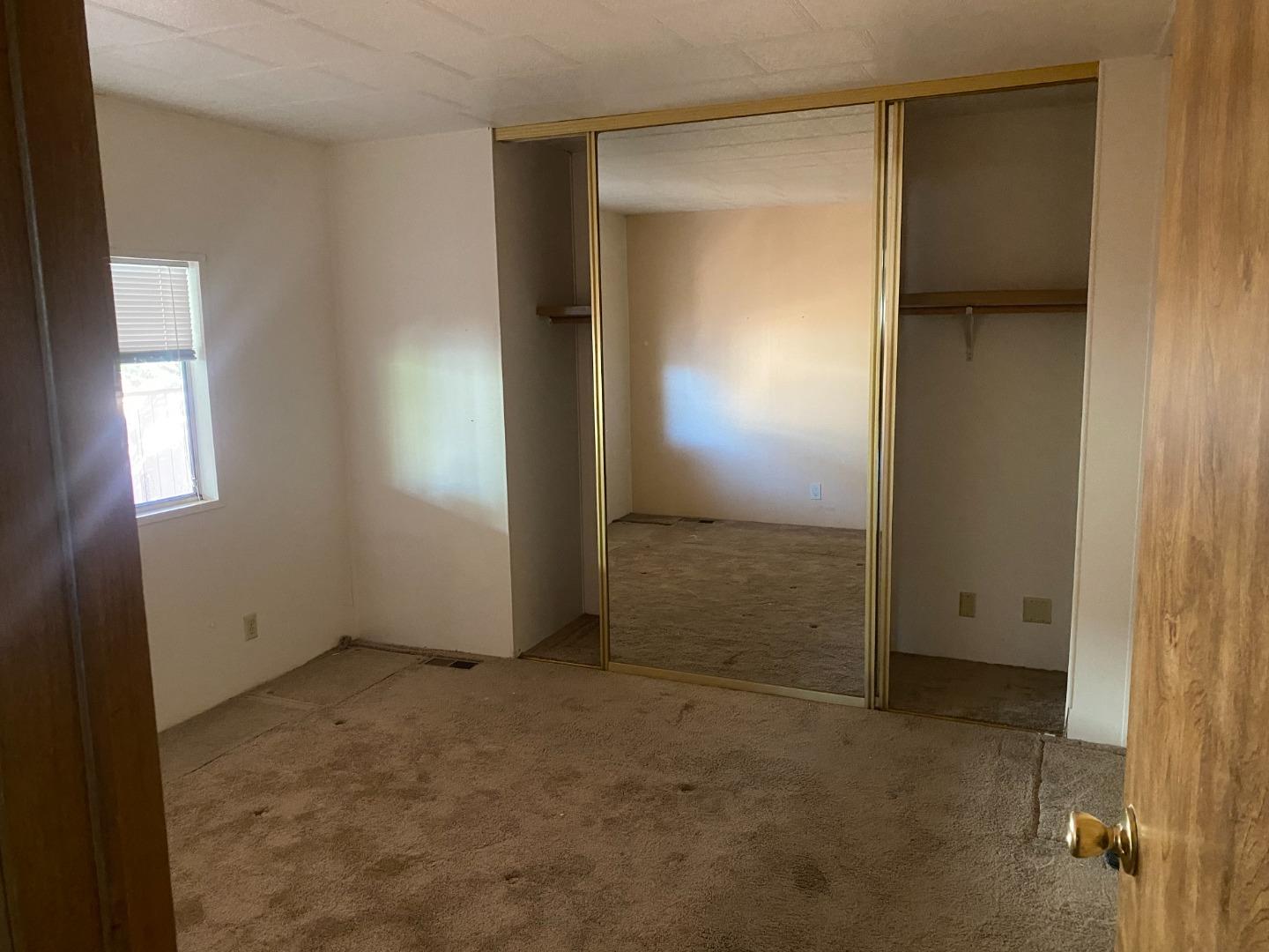 827 Villa Teresa Way, Unit 827 San Jose, CA 95123 - Photo 12 of 21 an empty room with windows and closet