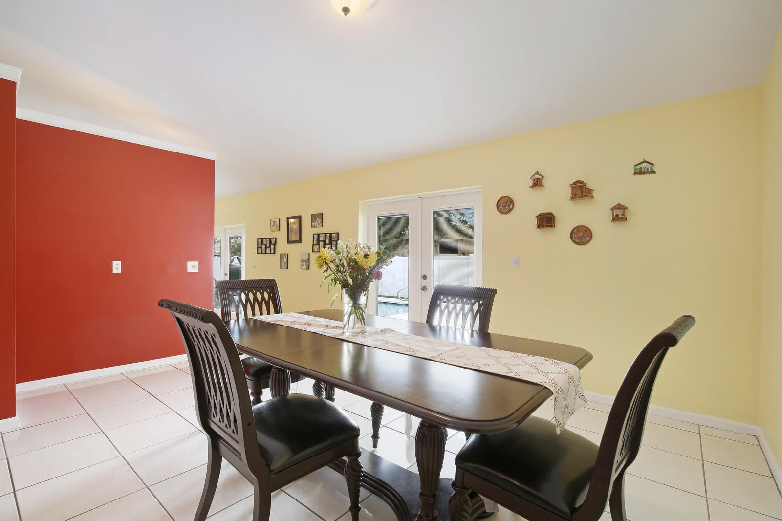 2144 Park Place Boca Raton, FL 33486 - Photo 5 of 20 a view of a dining room with furniture and wooden floor