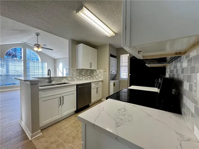a kitchen with a stove and a sink